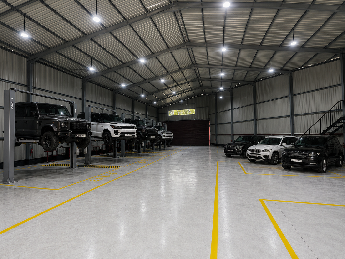 Full workshop panoramic view with vehicles
